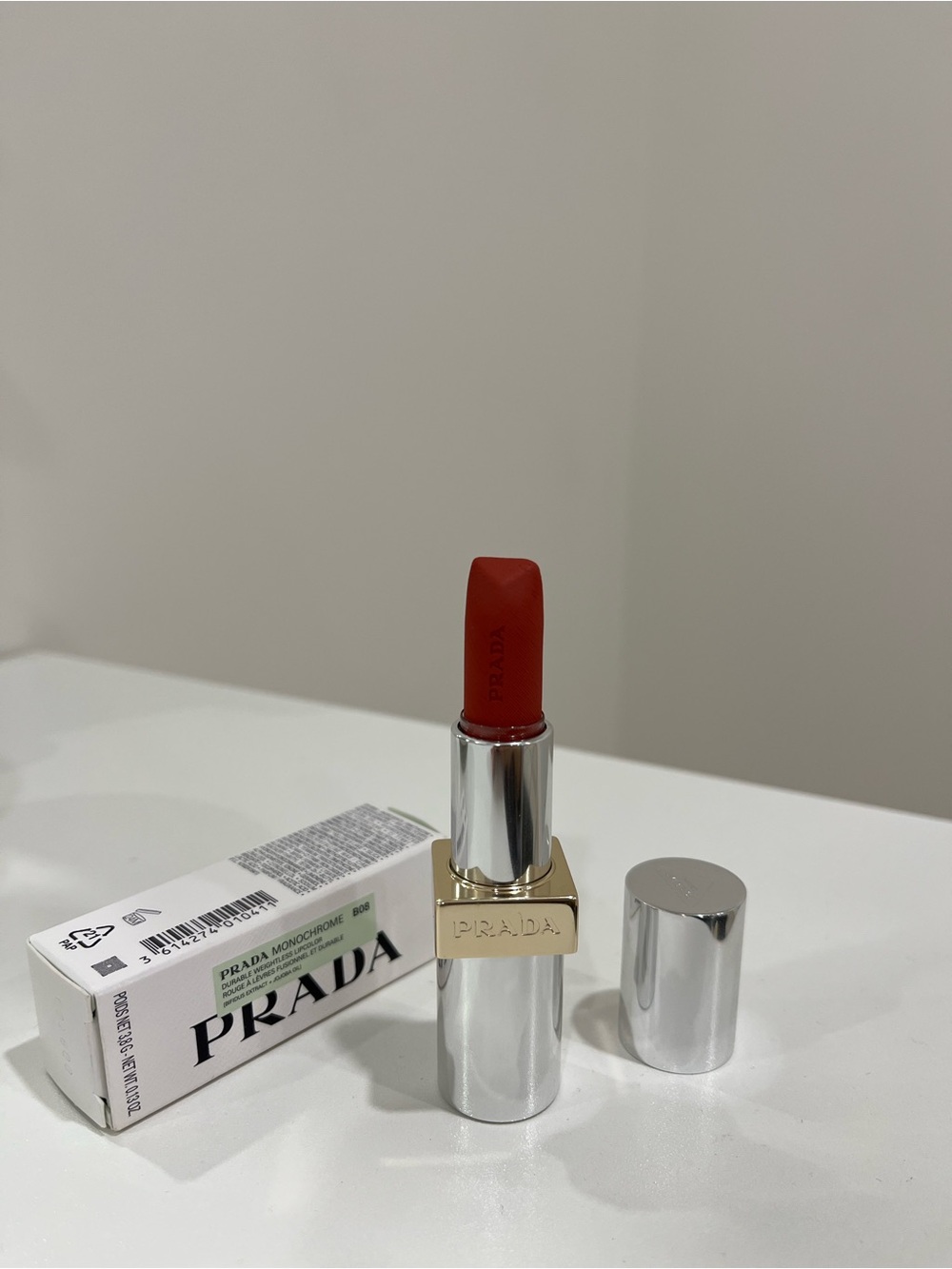 Prada Bold Red Lipstick in Sleek Silver Case